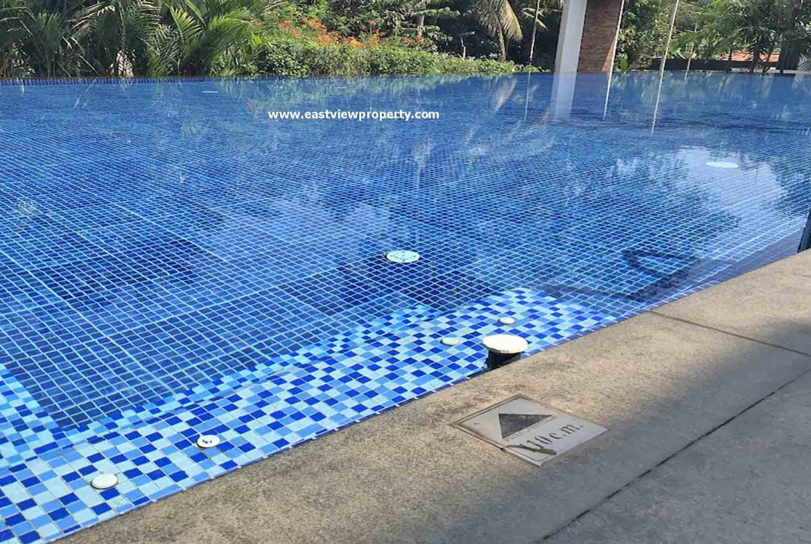 Infinity-edge swimming pool at Skyline The Edge luxury apartments in Thiruvalla, Kerala.