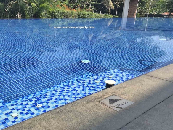 Infinity-edge swimming pool at Skyline The Edge luxury apartments in Thiruvalla, Kerala.