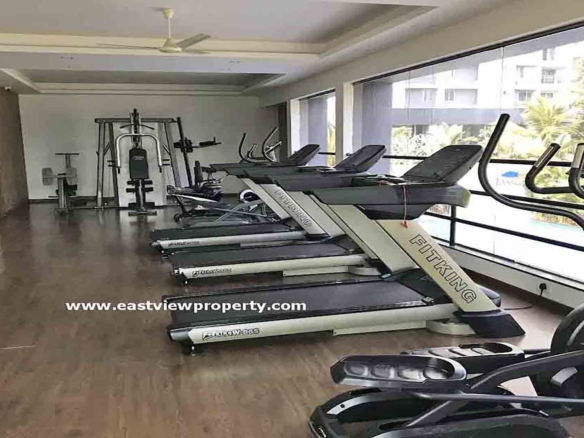 Modern fitness centre and gym for residents at Skyline The Edge luxury apartments in Thiruvalla.