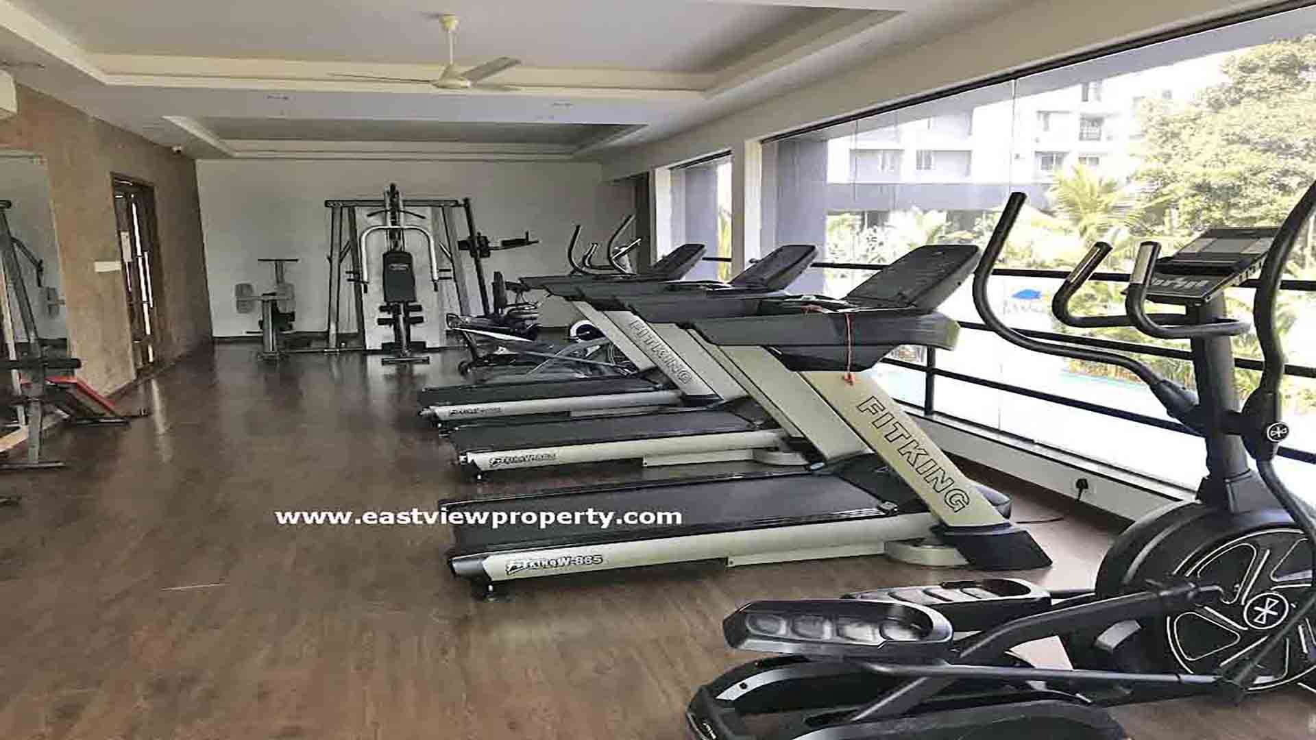 Modern fitness centre and gym for residents at Skyline The Edge luxury apartments in Thiruvalla.