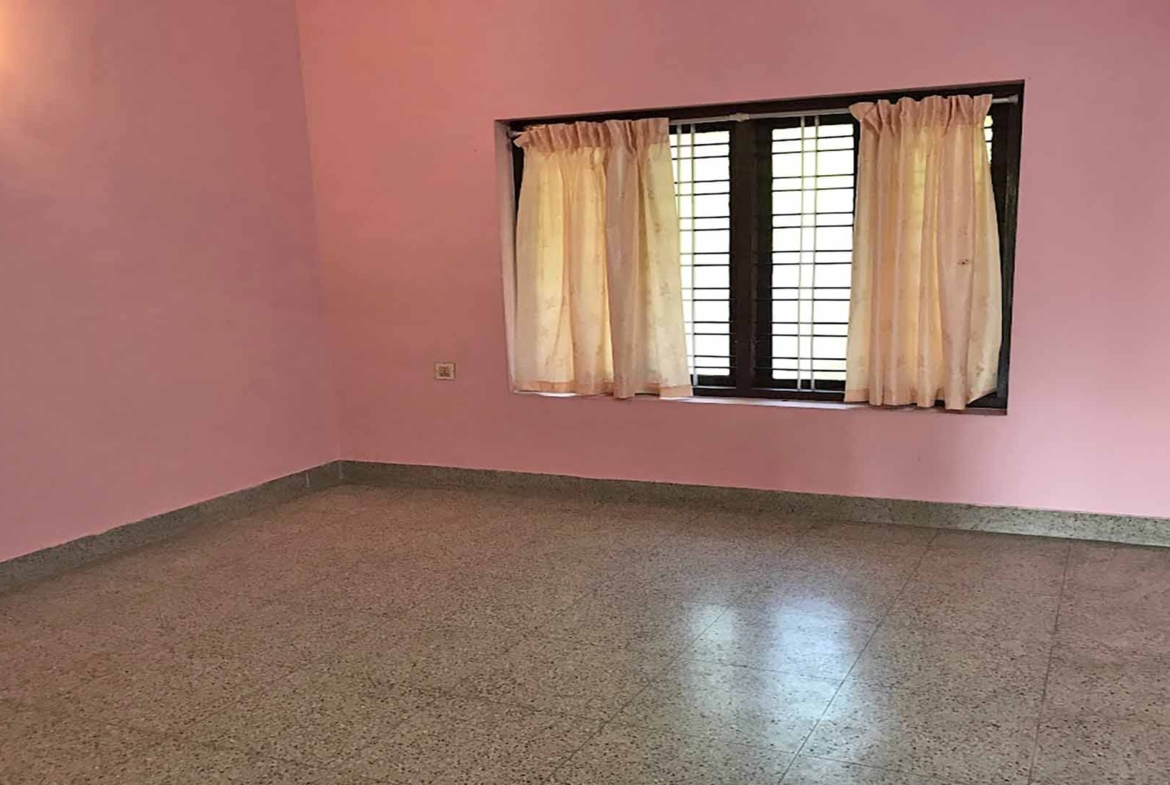 Spacious bedroom interior in 4 BHK house Chengannur