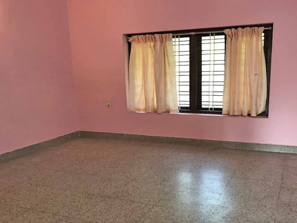 Spacious bedroom interior in 4 BHK house Chengannur