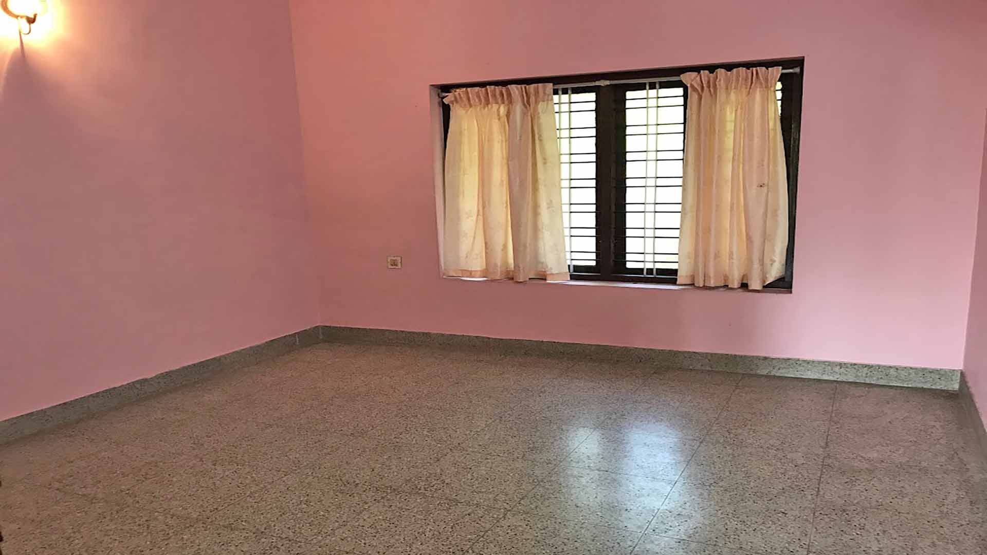 Spacious bedroom interior in 4 BHK house Chengannur