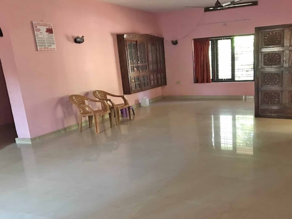 Interior living room with tiled floor in Chengannur house