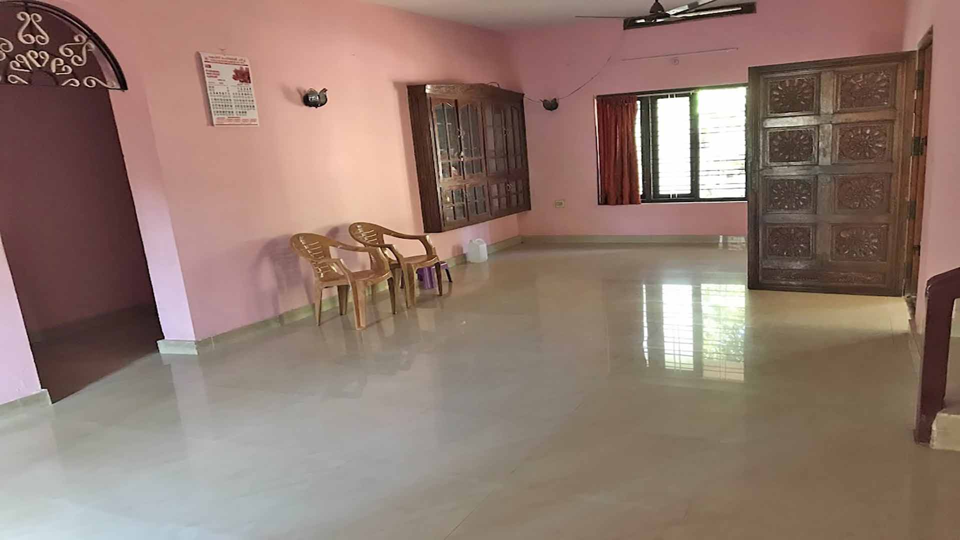 Interior living room with tiled floor in Chengannur house