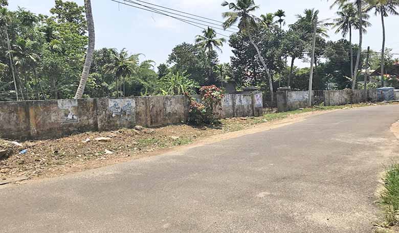 View of the wide asphalted Kulakkadu road leading to the 26-cent investment land in Thiruvalla, Pathanamthitta District, Kerala.