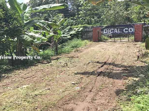 Gated entrance of 27 cents commercial land for sale in Thiruvalla Manjadi.