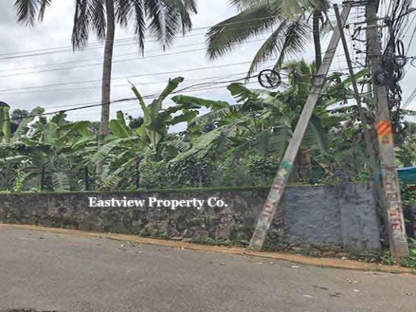 Commercial land for sale in Thiruvalla Manjadi with TK Road highway frontage.