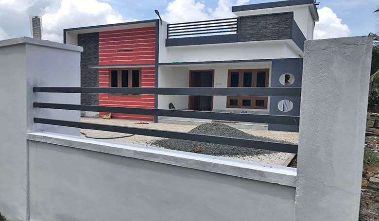 A single-storey 2-bedroom villa in Chengannur, Kerala, with a top grilled boundary wall and gate. Priced ₹ 50 Lakh (negotiable).