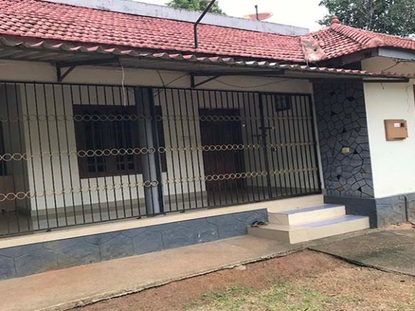 Single storey 2 BHK house with tiled roof and secured veranda with grills in Kareelamukk, Thiruvalla