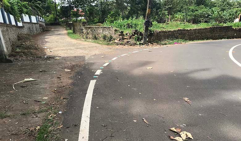Wide tarred main road Vittil Junction Road in Chengannur, Kerala, close to the land with access.